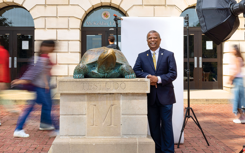 Professor Sudarsanam “Suresh” Babu, with Testudo, in front of the McKeldin Library on the University of Maryland campus