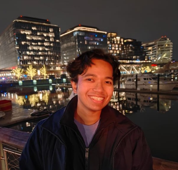 Anish Chamuah standing against a backdrop of the NY skyline