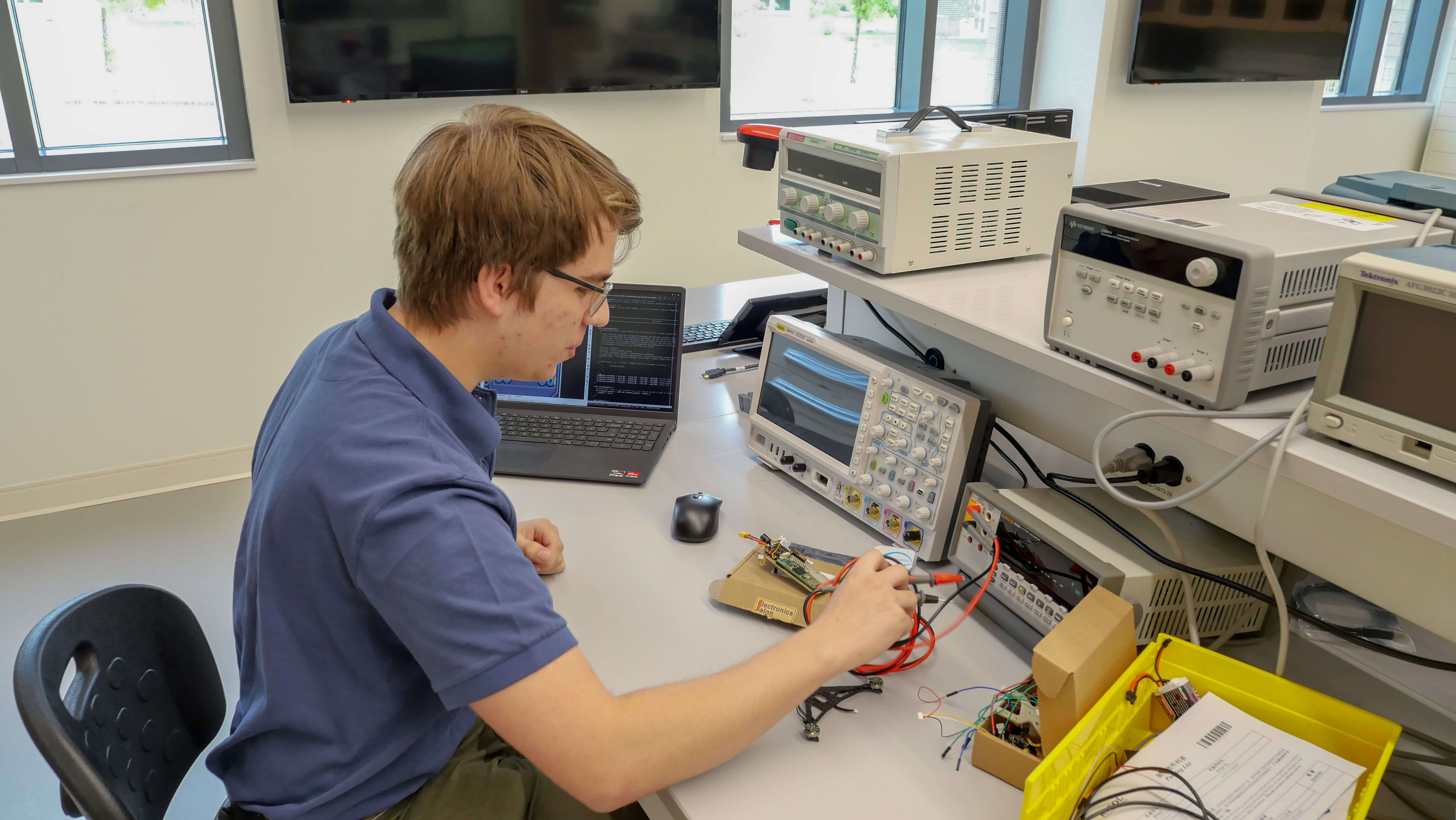 student in electrical engineering lab