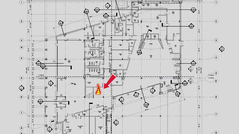 An animation of a computer computer simulation showing a spreading fire and people evacuating a building