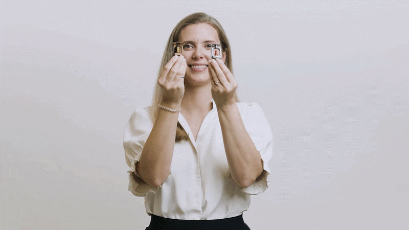 Rosalie Hrybyk holds up two fire sprinkler nozzles