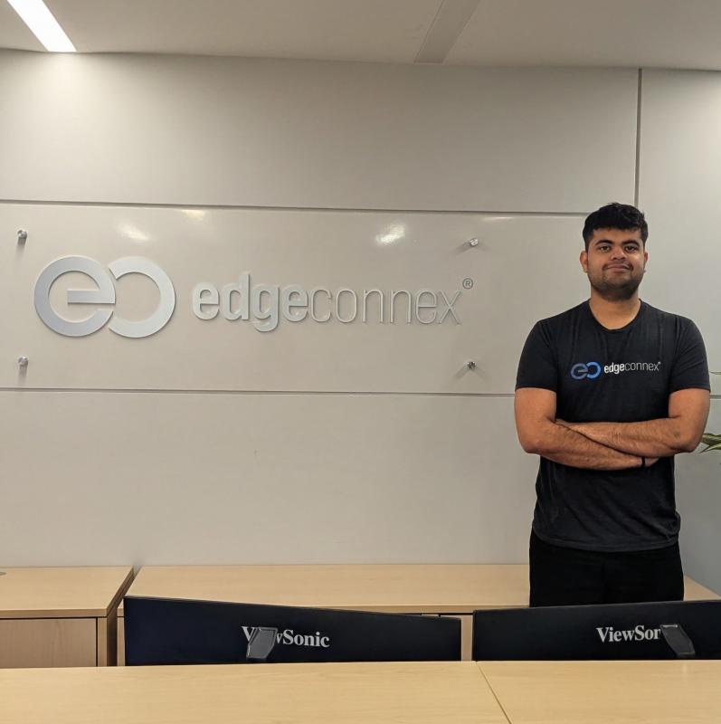 Sidharth Menon in front of EdgeConneX sign