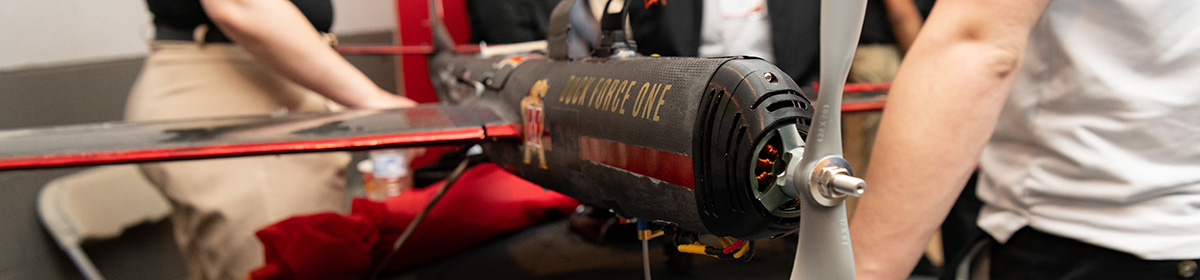 Model propeller airplane labeled Duck Force One