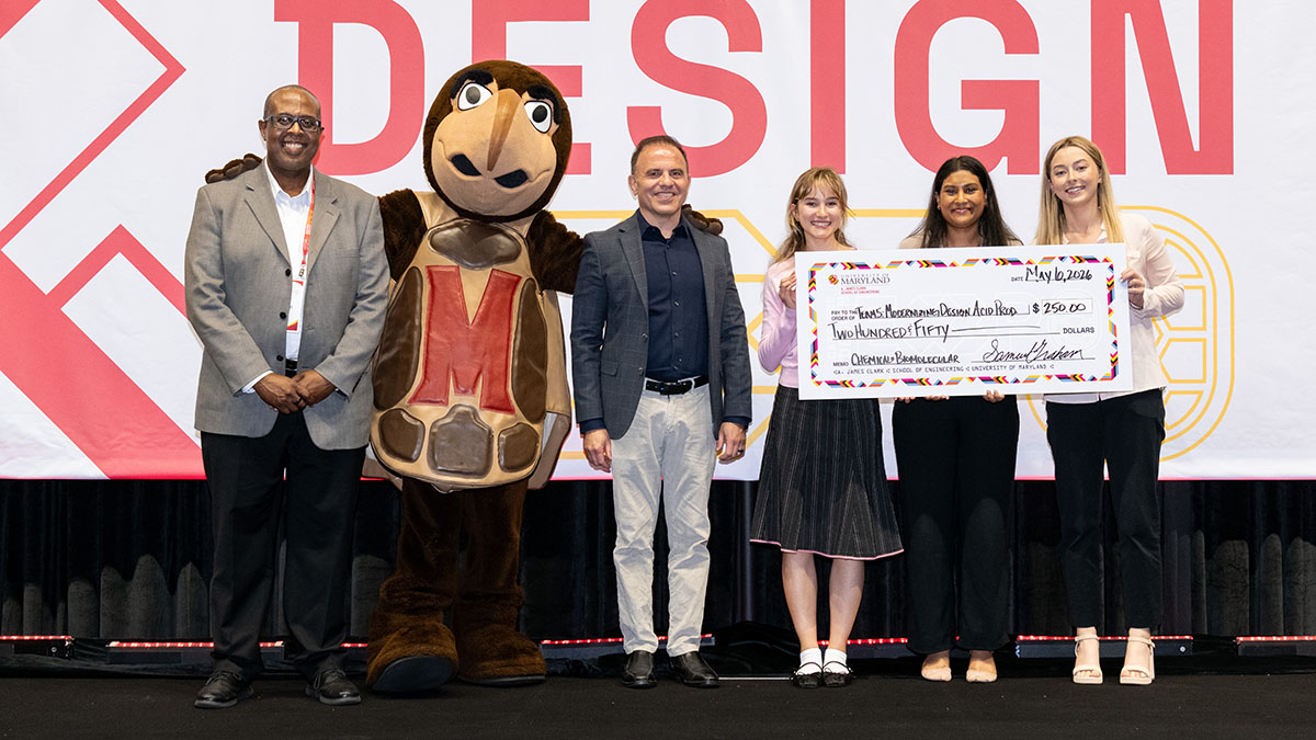 ChBE students hold a giant check for $250