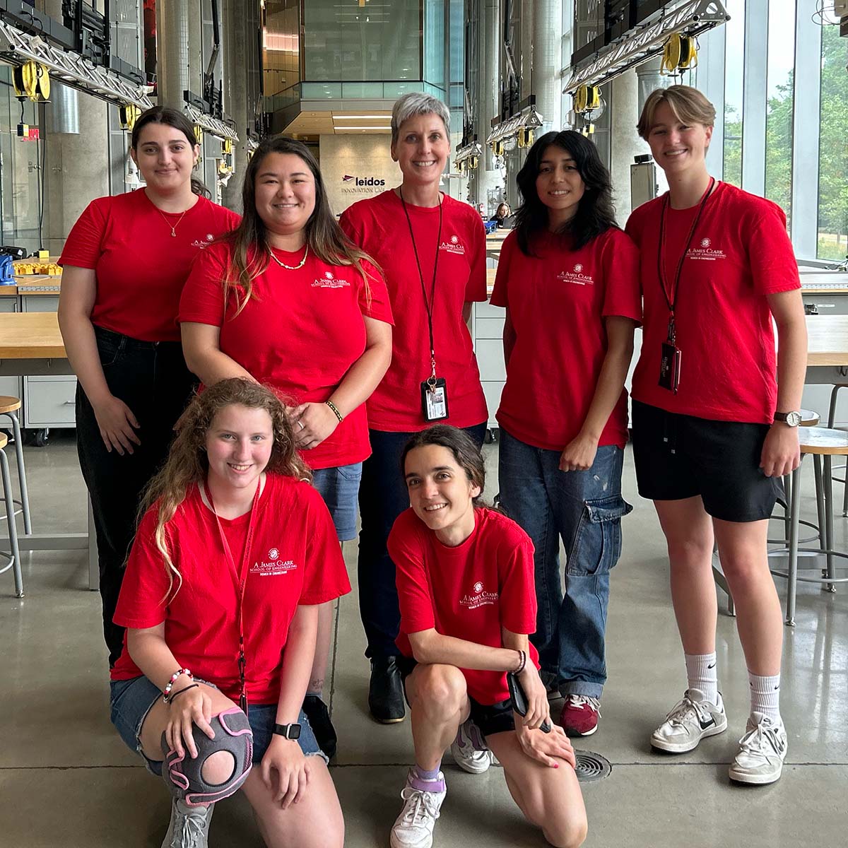 A group of women wearing red UMD shirts, including Chelsea Neumann