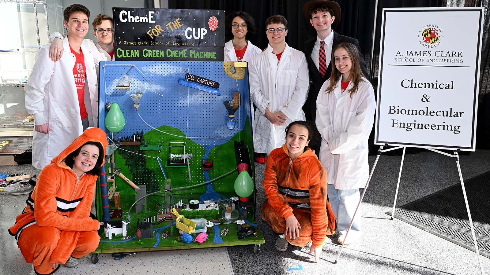 The ChemE team poses around its Rube Goldberg device
