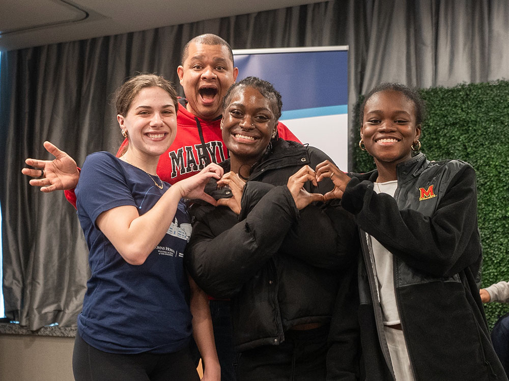 Clark Scholars make hearts with their hands