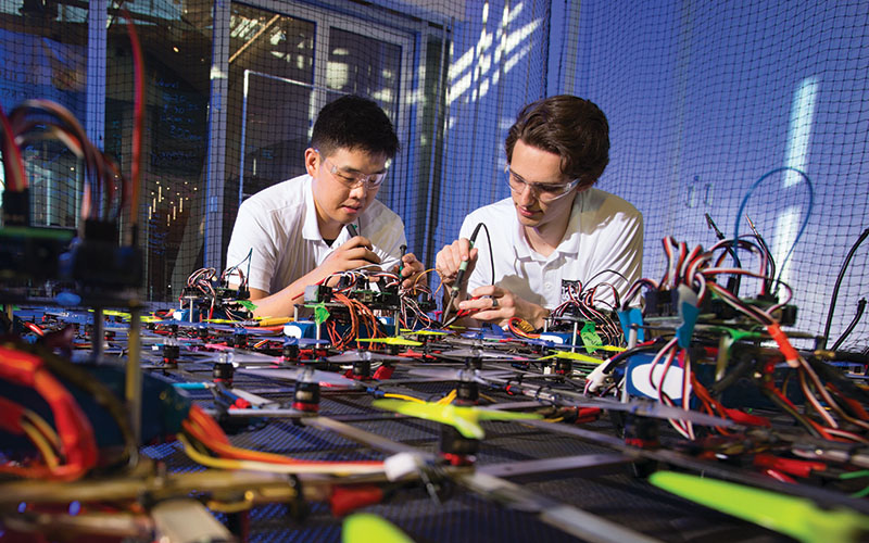 Two students work on an electric circuit