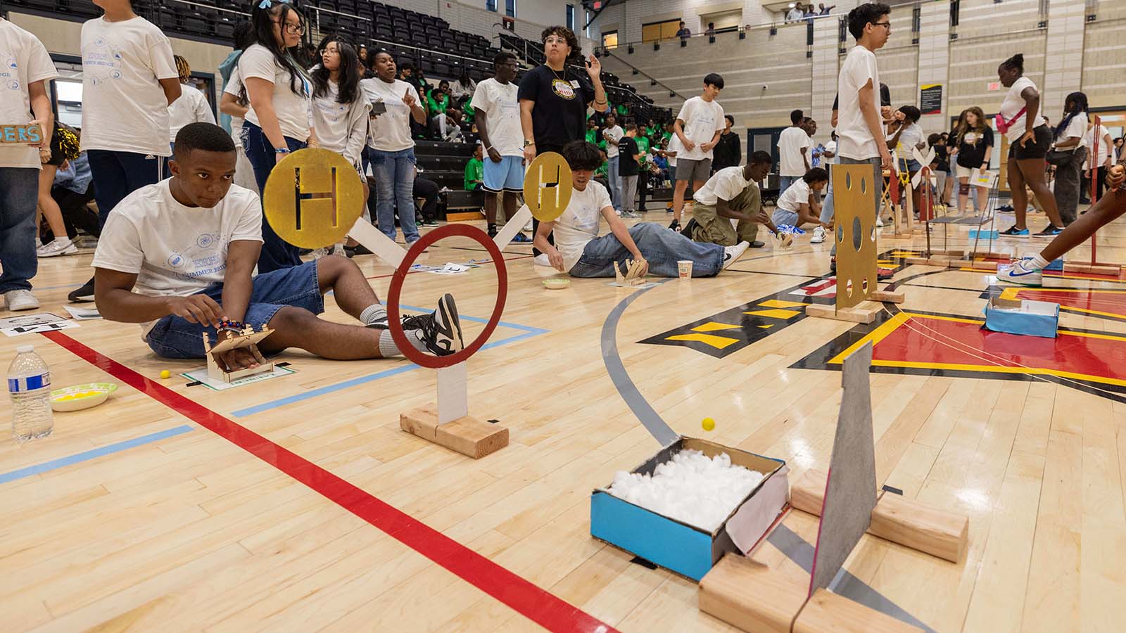 Student plays with an engineering kit