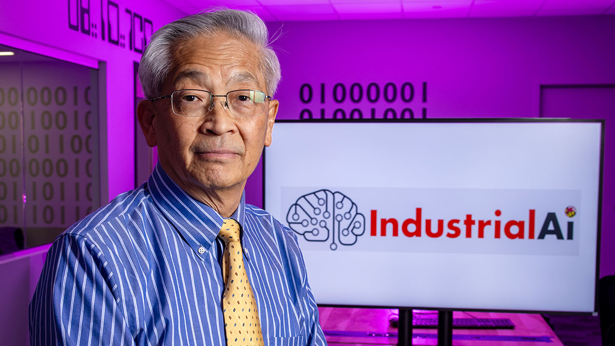 Professor Jay Lee with a screen reading Industrial AI