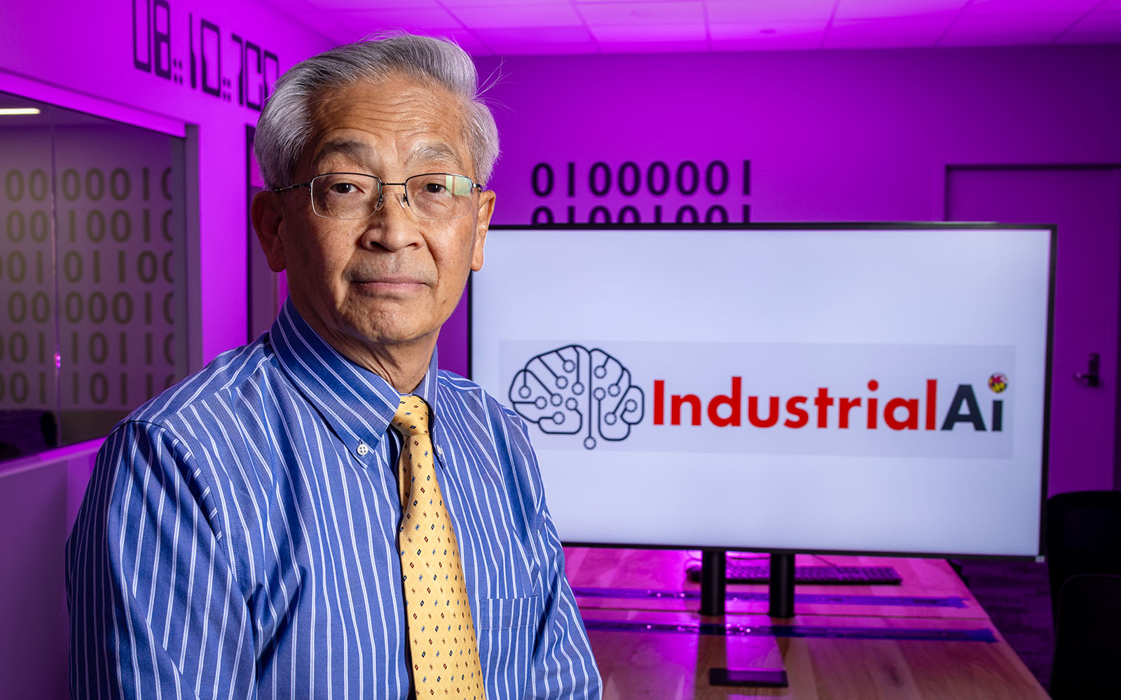 Professor Jay Lee with a screen reading Industrial AI