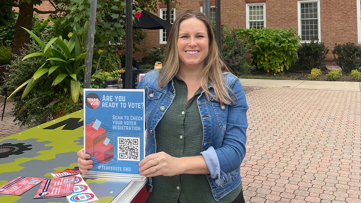 A person at a Terps Vote table at UMD campus
