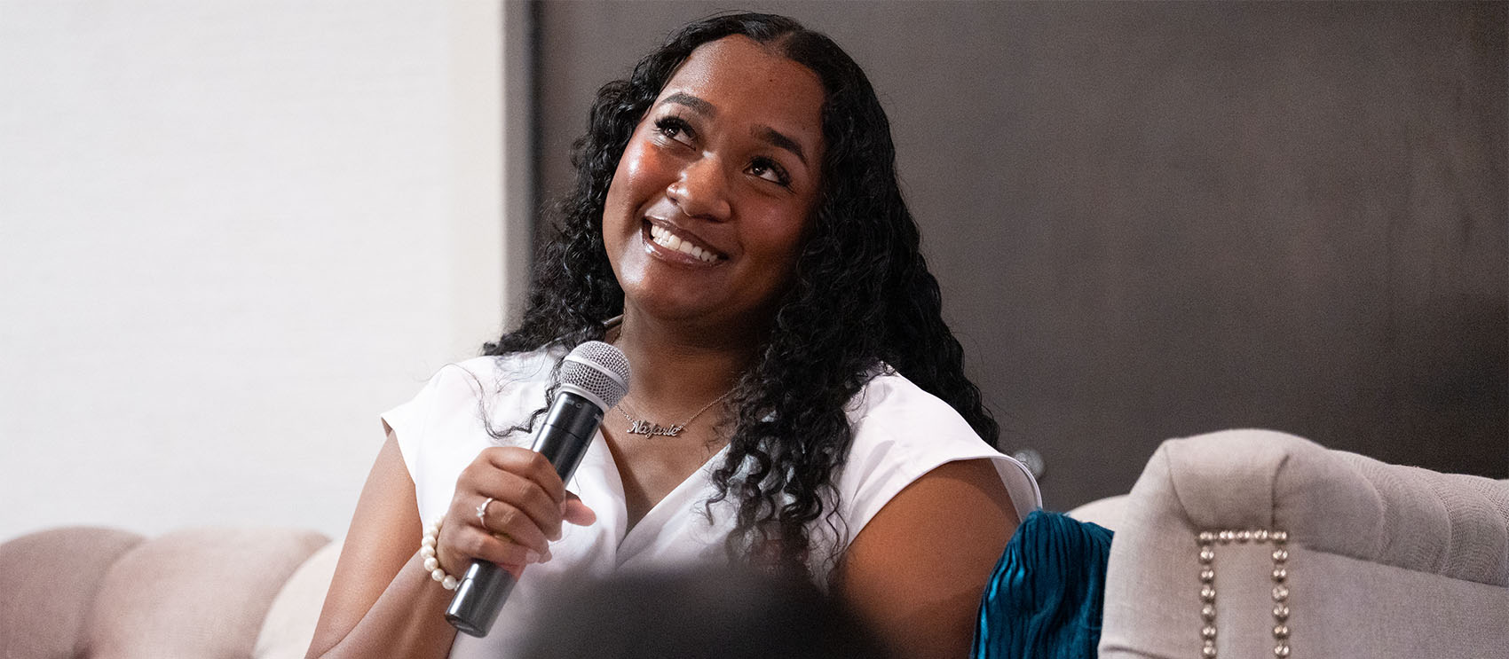 Najarie Williams ’24, M.S. ’24 Najarie Williams speaks into a handheld microphone