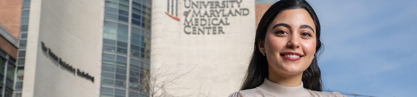 Nane Manyukan poses in front of the University of Maryland Medical Center