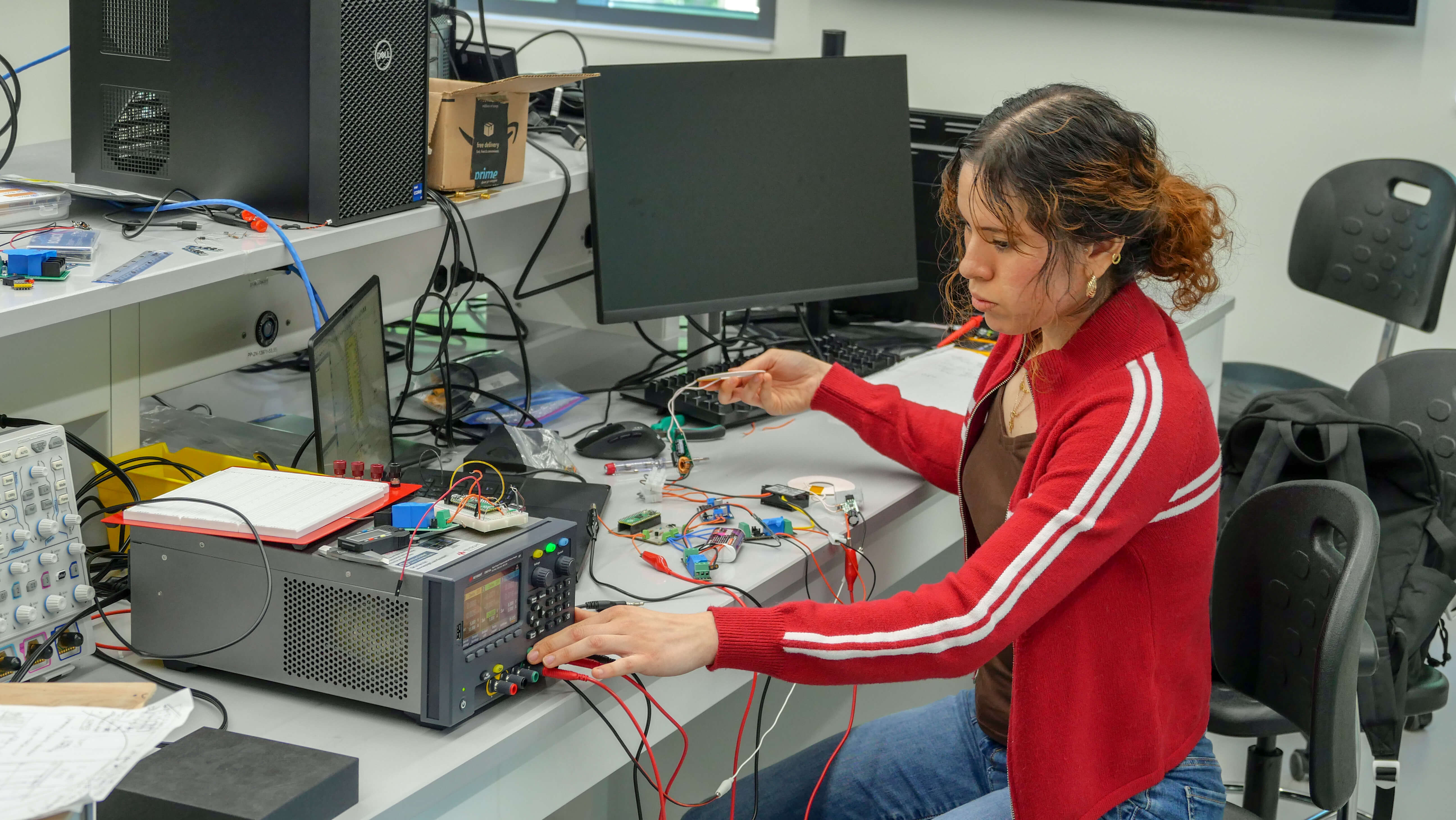 student in electrical engineering lab
