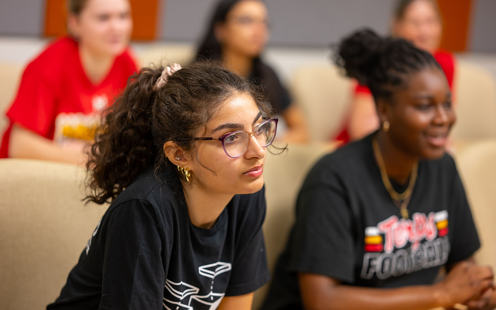 Students sit in a classroom